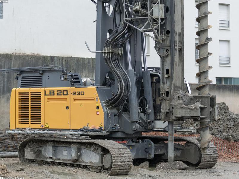 Excavation and shoring on a tight urban site between two buildings.